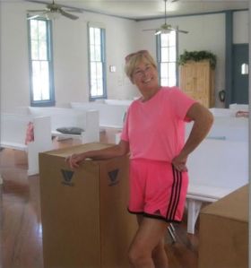 The Historical Society of Sarasota County Vic-=President Marsha Fottlerworks hard, even in pink shorts!